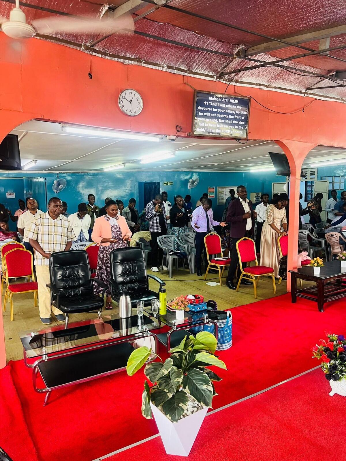 Church interior during a service with congregation standing